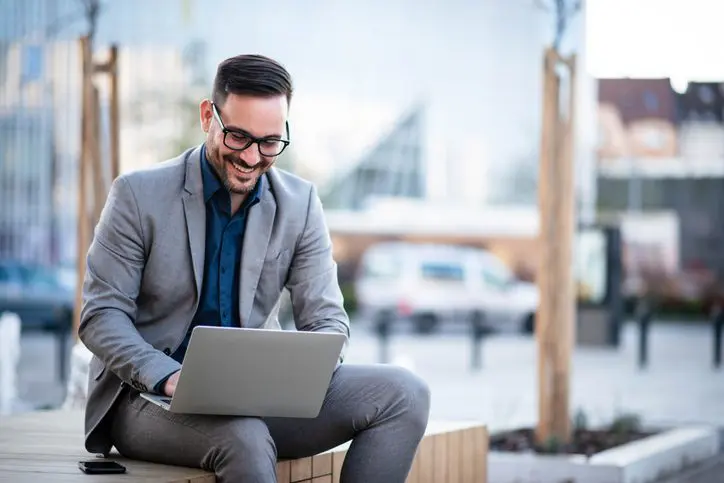 Businessman dressed formally outdoors