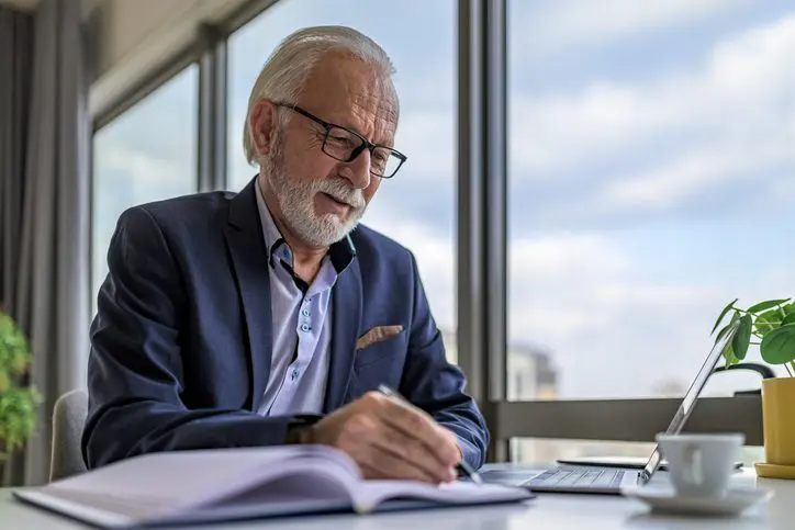 Businessman focused on laptop at desk