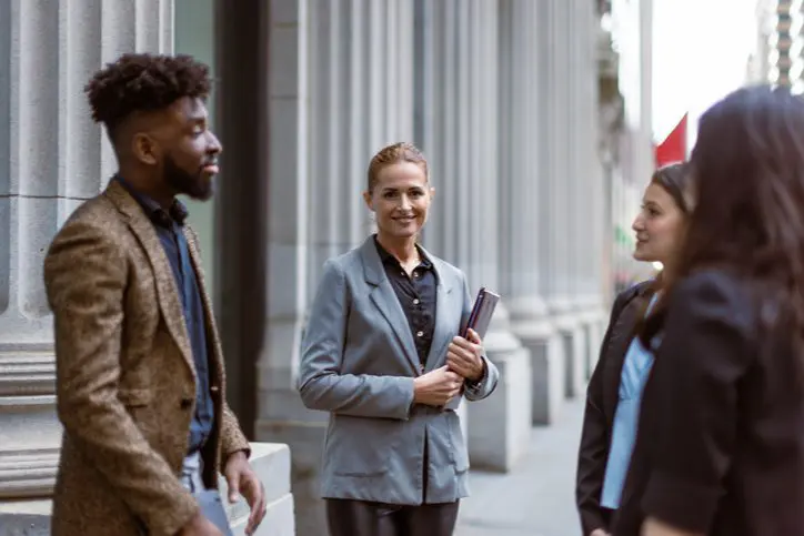Business people working in Wall Street area