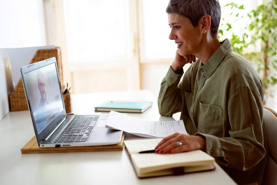 Businessmen working together in a home setting.